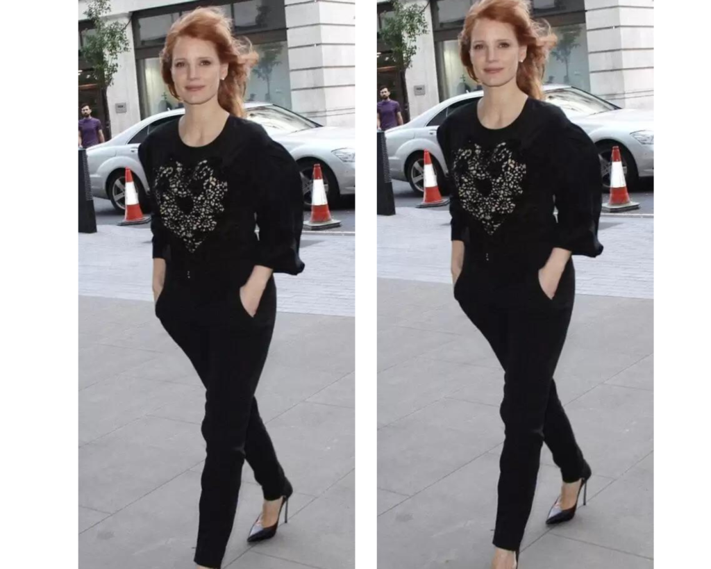 Jessica Chastain wearing black blouse with heart shape embroidery on it